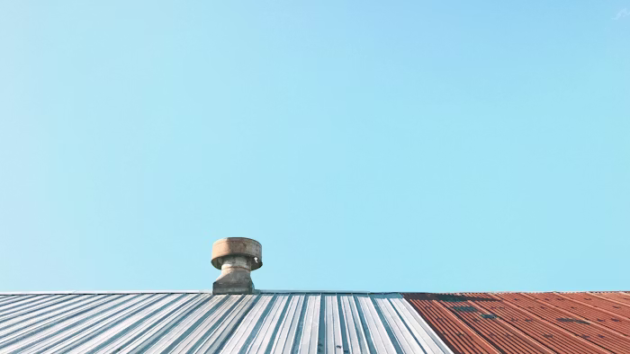 Low-slope flat roof with vent detail