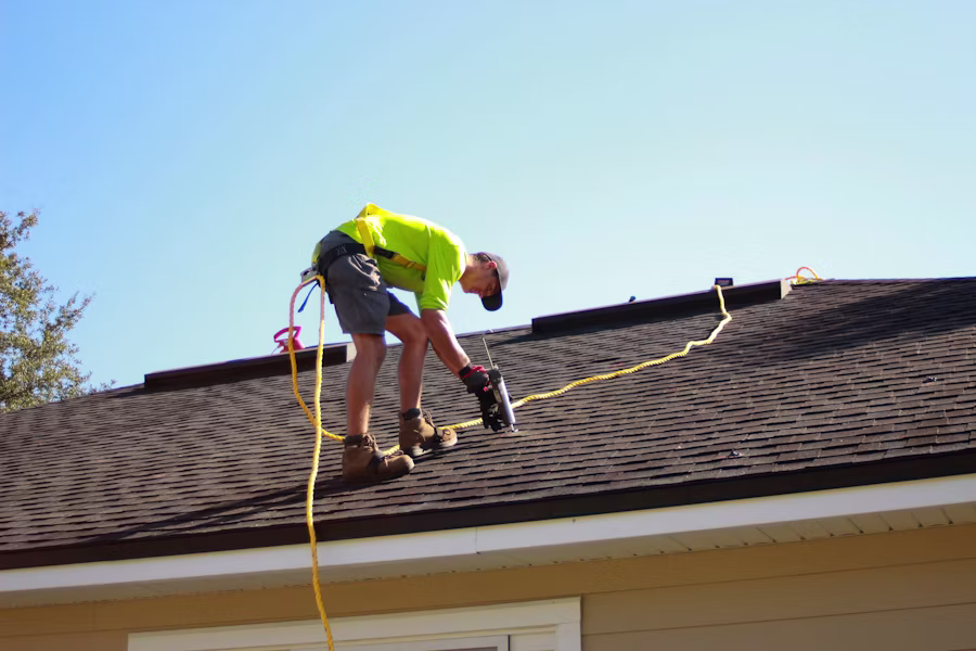 Licensed roofer working on a roof in Sarasota